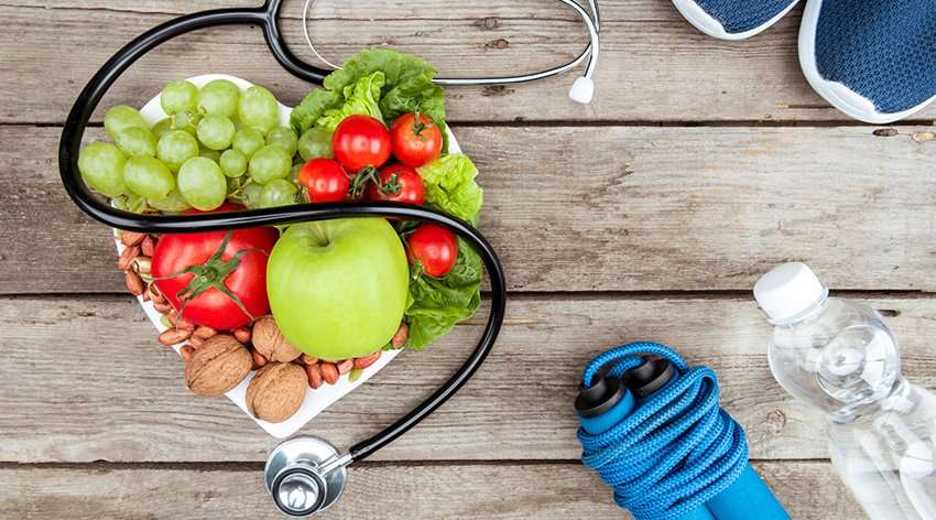 Heart health heart month Stethoscope organic food and sport equipment